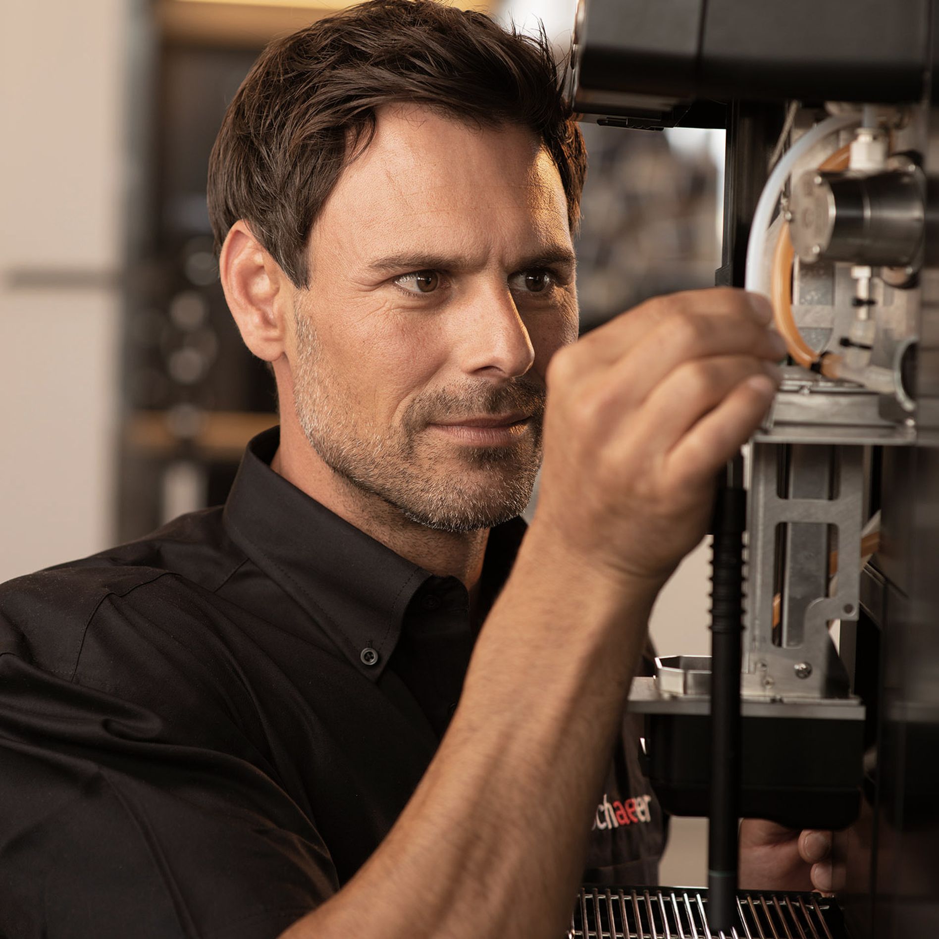 Schaerer service technician working on coffee machine