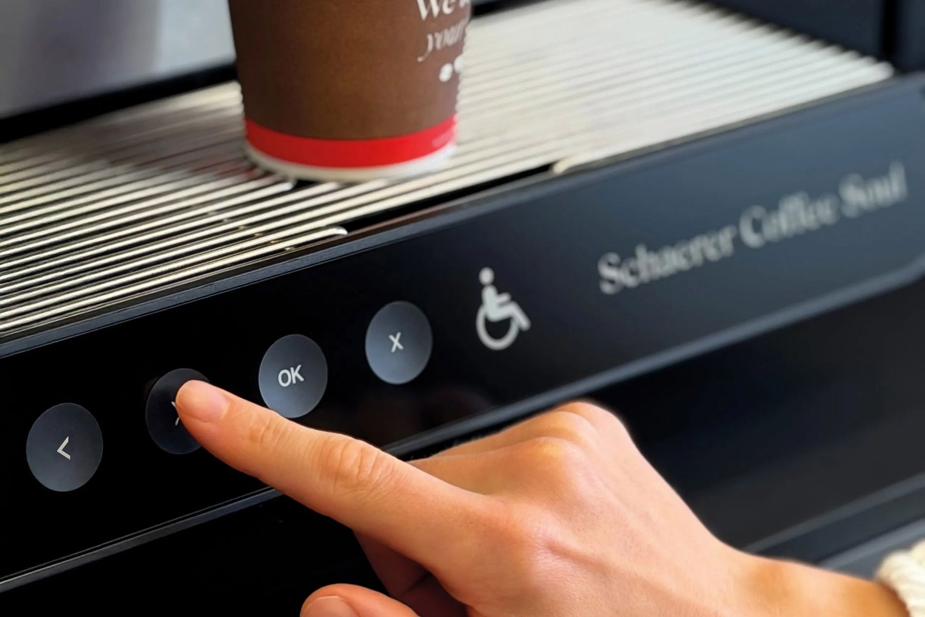 Schaerer Easy Access accessbility feature with a hand